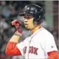  ?? Adam Glanzman Getty Images ?? MOOKIE BETTS is rare power hitter with more walks than strikeouts.