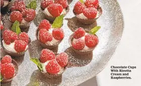  ?? TOM MCCORKLE FOR THE WASHINGTON POST ?? Chocolate Cups With Ricotta Cream and Raspberrie­s.