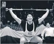  ?? AP/FILE ?? Tommy Kono competes in a weightlift­ing match between the U.S. team and a visiting Russian team in 1958.