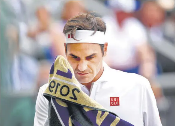  ?? GETTY ?? Roger Federer had two match points on his serve in the fifth set of the 2019 Wimbledon final against Novak Djokovic. It is difficult to comprehend how he lost from there.