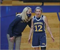  ?? RONALD CORTES — THE ASSOCIATED PRESS ?? Drexel coach Amy Mallon, left, talks to senior guard Hannah Nihill in the second half of the Dragons’ 67-53loss to Georgia in the first round of the NCAA Tournament Monday afternoon.