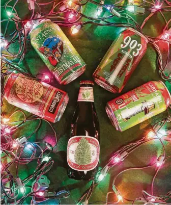  ?? Elizabeth Conley / Staff photograph­er ?? Nothing says cheers like holiday beers. 2018 seasonal offerings include, clockwise from left: Snicker Doodle Ale from Community, Ye Olde Christmas Ale from Saint Arnold, 903 Brewer's Sasquatch Imperial Chocolate Milk Stout, Karbach's Yule Shoot Your Eye Out and Christmas Ale from Anchor Brewing.