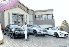  ?? Picture: Twitter ?? Bushiri poses outside his house with some of his luxury vehicles.