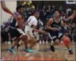  ?? TIM PHILLIS — FOR THE NEWS-HERALD ?? Benedictin­e’s Davin Zeigler handles the ball during a game at Garfield Heights on Feb. 7.