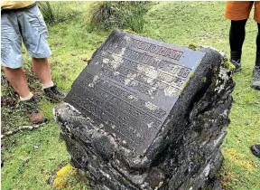  ?? KAMALA HAYMAN/
STUFF ?? Hollyford
farmer, adventurer
and guide, Davey Gunn, is remembered in a stone plaque behind Pyke
Lodge.