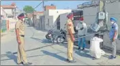  ??  ?? Police and villagers blocking the entry to Dhablan village in Patiala on Saturday.