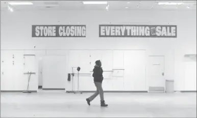  ?? MATHEW MCCARTHY, RECORD STAFF ?? On the last day of its operation, the store had some sections already barren. Some shoppers felt its decline was inevitable.