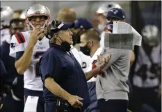  ?? JOHN FROSCHAUER THE ASSOCIATED PRESS ?? FILE - New England Patriots head coach Bill Belichick catches a packet of papers after he tossed them in the air during the second half of an NFL football game against the Seattle Seahawks in Seattle, in this Sunday, Sept. 20, 2020, file photo.