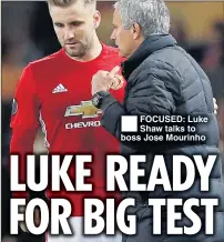  ??  ?? FOCUSED: Luke Shaw talks to boss Jose Mourinho