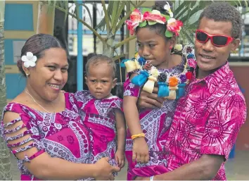  ?? Photo: Yogesh Chandra ?? From left; Salailagi Waqabaca holding her one-year-old daughter Angel Debora and Tomasi Waqabaca holding Marrion Faith after her graduation at Bethel Kindergart­en in Labasa on November 13, 2018.