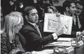  ?? WASHINGTON POST ?? Rep. Henry Cuellar shows a border map at a meeting last month. He’s “cautiously optimistic,” a deal will be reached.