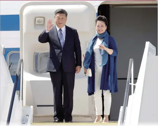  ?? Photo: AP ?? Chinese President Xi Jinping and his wife Peng Liyuan arrive for the G20 summit in Hamburg, Germany on Thursday.