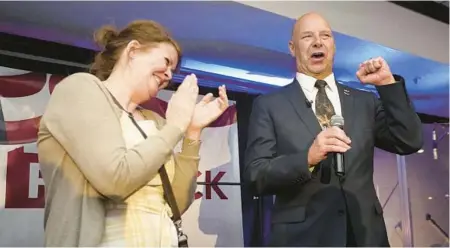  ?? CAROLYN KASTER/AP ?? State Sen. Doug Mastriano, a GOP candidate for Pa. governor, speaks on a primary night May 17 in Chambersbu­rg, Pa., with his wife, Rebecca.