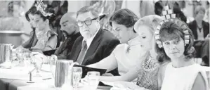  ?? CLAIRE FOLGER, WARNER BROS. PICTURES ?? Nina (Adrienne Barbeau, right) takes a seat at the table read of the (fake) movie within the movie Argo.