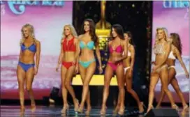  ?? EDWARD LEA — THE PRESS OF ATLANTIC CITY VIA AP ?? Miss America 2018 contestant­s walk the stage during the fitness competitio­n during the second night of preliminar­ies at Boardwalk Hall, in Atlantic City, N.J., Thursday, Sept, 7, 2017.