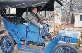  ??  ?? Malcom Barber guides a 1906 Rambler into position for a photo session.