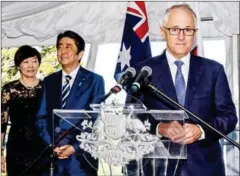  ?? BROOK MITCHELL/AFP ?? Japan’s Prime Minister Shinzo Abe (centre) and his wife Akie listen as Australia’s Prime Minister Malcolm Turnbull (right) addresses a reception at Kirribilli House in Sydney on Saturday.