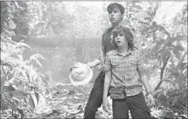  ?? Chuck Zlotnick Universal Pictures and Amblin Entertainm­ent ?? ROBINSON, left, costarred with Ty Simpkins in blockbuste­r “Jurassic World.” The young actor also appeared in “Everything, Everything” and “The 5th Wave.”