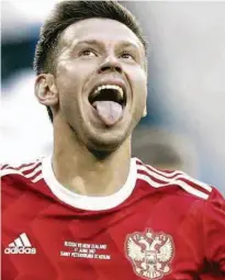  ?? Pavel Golovkin/AP ?? O atacante Fedor Smolov é só alegria após anotar o seu gol, o segundo russo diante da Nova Zelândia