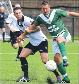  ?? Picture: Paul Amos FM4428034 ?? Ashford’s Shaun Welford held back by Ramsgate’s Joe Kane