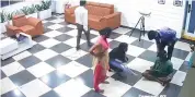  ??  ?? Police releases the CCTV footage of the Dalit victim being tonsured in Visakhapat­nam on Saturday.