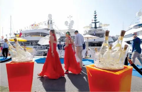  ?? (Eric Gaillard/Reuters) ?? VISITORS ARE seen during the Monaco Yacht show, one of the most prestigiou­s pleasure-boat shows in the world, highlighti­ng hundreds of yachts for the luxury-yachting industry, in the Port of Monaco in September. Switzerlan­d’s second-biggest bank is...