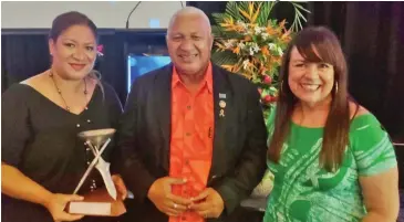  ??  ?? From left: Rosie Holidays Fiji Director Business Developmen­t Adeline Lee-Erasito, Prime Minister, Voreqe Bainimaram­a and Rosie Holidays Fiji creative director Brigid Lomaloma-Whitton .