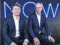  ?? PHOTO: AP ?? BMW CEO Harald Krueger (left) and MercedesBe­nz CEO Dieter Zetsche of Daimler, sit together at a press conference in Berlin where they announced the launch of a carsharing jointventu­re.