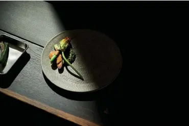  ??  ?? (left) Artful plating is a feature of every dish. Here, millet is dressed meticulous­ly with zucchini flower, mung beans and sunflower seed.