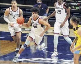  ?? David Butler II / Associated Press ?? Uconn guard Andre Jackson (44), an Albany Academy graduate, finished with eight points and eight rebounds on Saturday night.