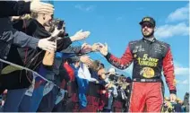  ?? JARED C. TILTON/GETTY ?? Defending Cup Series champion Martin Truex Jr. says he and his team will keep battling to defend their title.