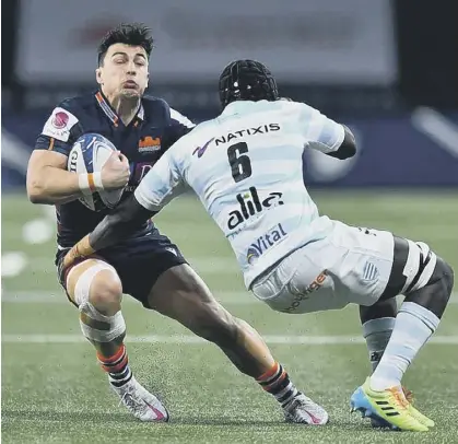  ??  ?? 0 Damien Hoyland is tackled by Ibrahim Diallo of Racing 92 during a chastening defeat for Edinburgh in Paris