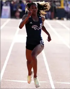  ?? PHOTOS BY KEITH BIRMINGHAM – STAFF PHOTOGRAPH­ER ?? Naomi Johnson of Roosevelt takes the CIF-SS Division 1girls 200-meter race on Saturday. Later, she anchored the 4x400 relay, which clinched a team title.
