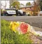  ?? Rich Pedroncell­i AP ?? FLOWERS mark where Davis Police Officer Natalie Corona was slain.