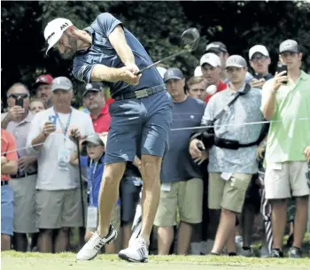  ?? CHRIS CARLSON/THE ASSOCIATED PRESS ?? Dustin Johnson hits a tee shot during a practice round at the PGA Championsh­ip on Tuesday at the Quail Hollow Club in Charlotte, N.C. The internet collapsed in paroxysms when the PGA of America broke with decades of tradition and allowed players to...