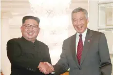  ?? — Reuters ?? North Korea’s leader Kim Jong Un with Singapore’s Prime Minister Lee Hsien Loong at the Istana in Singapore.