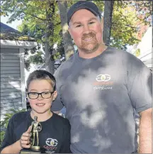  ??  ?? Bryson MacNeil, left, and his dad Jason both enjoy drag racing.