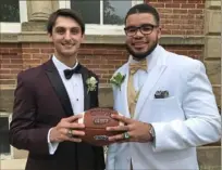  ??  ?? The Washington HIgh School football careers of Zack Swartz, left, and Gerald Comedy were closely linked as quarterbac­kcenter and that’s how they’ll end — 12 in their senior class, Swartz as valedictor­ian and Comedy as salutatori­an.