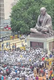  ?? PTI ?? Karnataka Congress and JD(S) MLAs stage a dharna in front of the Gandhi statue near the assembly in Bengaluru on Thursday.