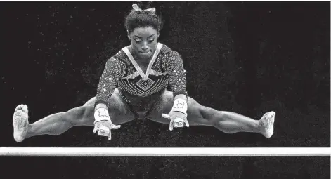  ?? Maddie Meyer / Getty Images ?? Biles built her lead in the uneven bars rotation, the only event she didn’t qualify for the finals in the Rio Olympics.