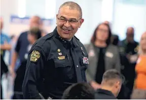  ?? STEPHEN M. DOWELL/ORLANDO SENTINEL ?? Orlando Police Chief Orlando Rolón smiles before a "Hate Crimes & Racial Inequality Public Safety" forum at the Orlando Police Department headquarte­rs on Thursday.