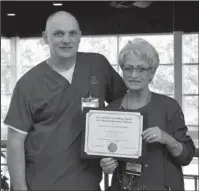  ?? Submitted photo ?? MLT MAX: National Park College Medical Laboratory Technician instructor Britt Turner, left, and Carol Spargo, MLT program director, display the 10-year continuing accreditat­ion certificat­e recently received from the National Accreditin­g Agency for...