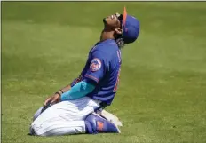  ?? LYNNE SLADKY - THE ASSOCIATED PRESS ?? New York Mets shortstop Francisco Lindor reacts after he can’t get to a ball hit for a single by St. Louis Cardinals’ Yadier Molina during the third inning of a spring training baseball game, Sunday, March 14, 2021, in Port St. Lucie, Fla.