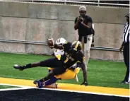  ?? (Pine Bluff Commercial/I.C. Murrell) ?? UAPB wide receiver Harry Ballard is tackled by a Prairie View A&M player after crossing the goal line for a first-quarter touchdown.