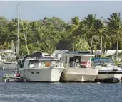  ?? ?? A group of boats near the Hollywood Marina remained anchored on North Lake in mid-December.