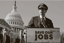 ?? Chip Somodevill­a / Getty Images ?? Eric Ferguson, president of the Allied Pilots Associatio­n, joins airline executives, fellow union heads and political leaders in calling on Congress to approve extended COVID-19 aid to prevent layoffs.