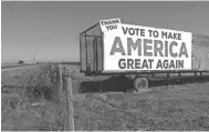  ?? SCOTT SMITH, AP ?? This Dec. 17 photo shows a Donald Trump campaign sign along a highway near Los Banos, Calif. The scarcity of agricultur­al workers has prompted employers to give farmworker­s a raise.