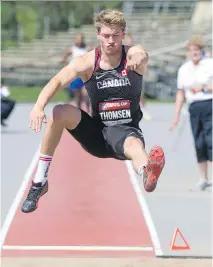  ?? WAYNE CUDDINGTON ?? Ryan Thomsen long jumps on Tuesday at the Canadian Track and Field Championsh­ips at the Terry Fox Athletic Facility.