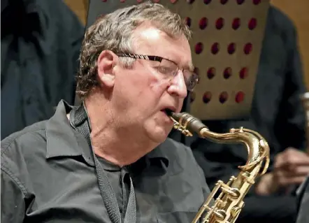  ??  ?? Murray Allen plays the saxophone in Sinfonia’s most recent concert. PHOTO: RICHARD LUMMUS