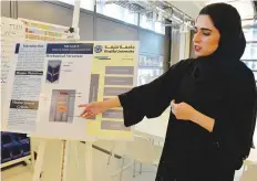  ?? Pankaj Sharma/Gulf News ?? Ameena Adheem, one of the students who designed the CubeSat, explains the process at Yahsat Space Lab.